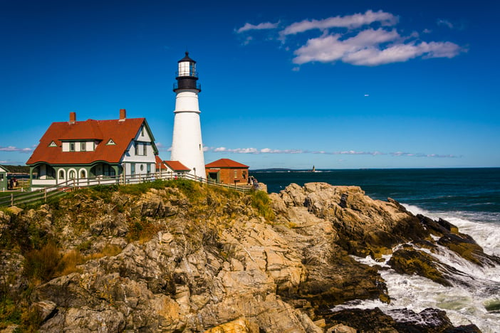 Portland Head Lighthouse and the Atlantic Ocean at Fort Williams Park in Cape Elizabeth, Maine.